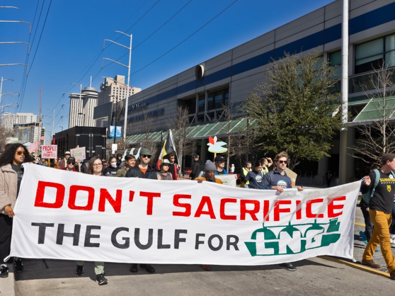 Protesters hold a banner reading "Don't sacrifice the Gulf for LNG" at a protest in New Orleans.